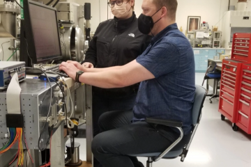 Courtesy Photo | AFRL physicists, Ryan Davidson (near) and Bryce Halter, examine test data from the main Precise satellite sensor, inside the Insitu Instrument Lab at AFRL's Space Vehicles Directorate.